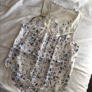 Sleeveless floral blue and cream colored blouse